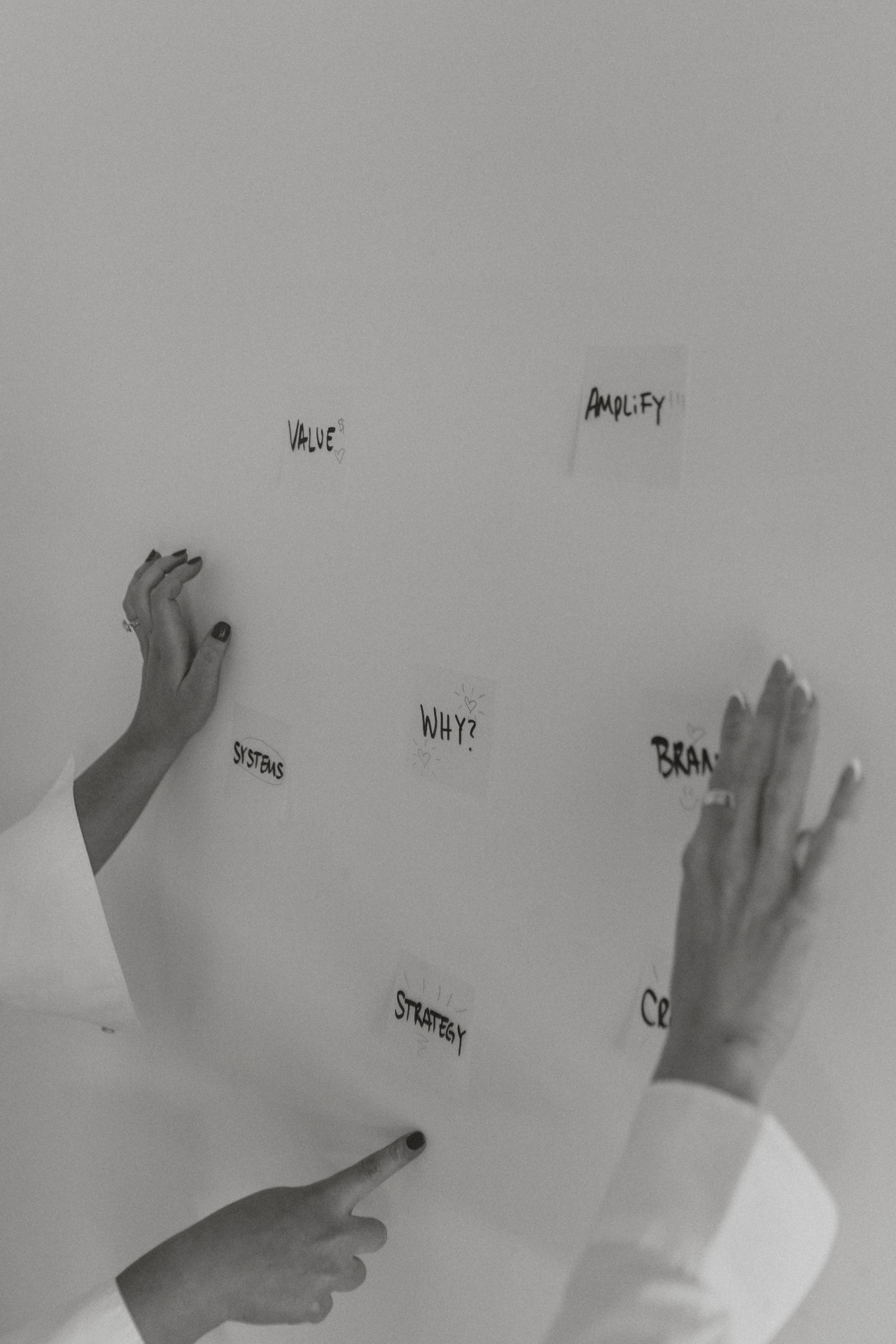 Hands against a textured wall